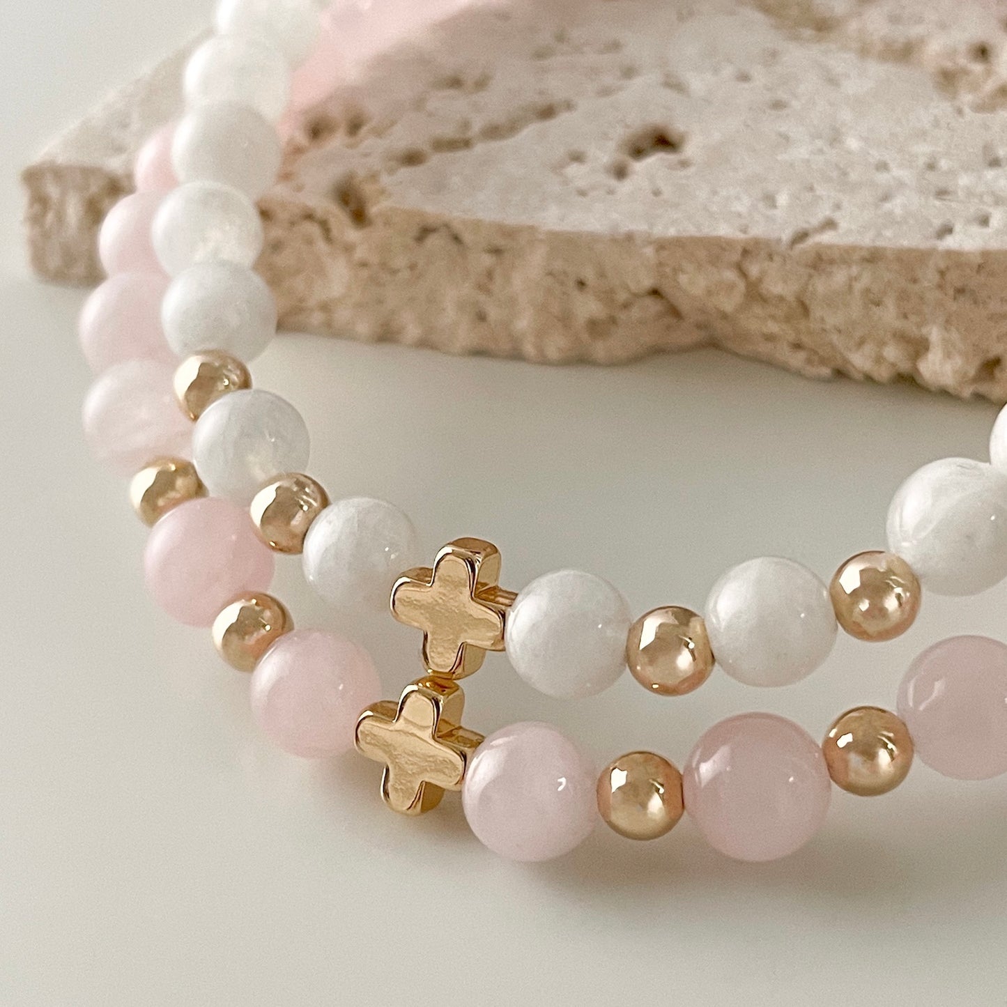 Stacked Rose Quartz and White Moonstone gemstone bracelet with 14k gold metal accent handmade crystal jewellery in Australia by Ann Saint James, an Australian crystal jewellery brand.